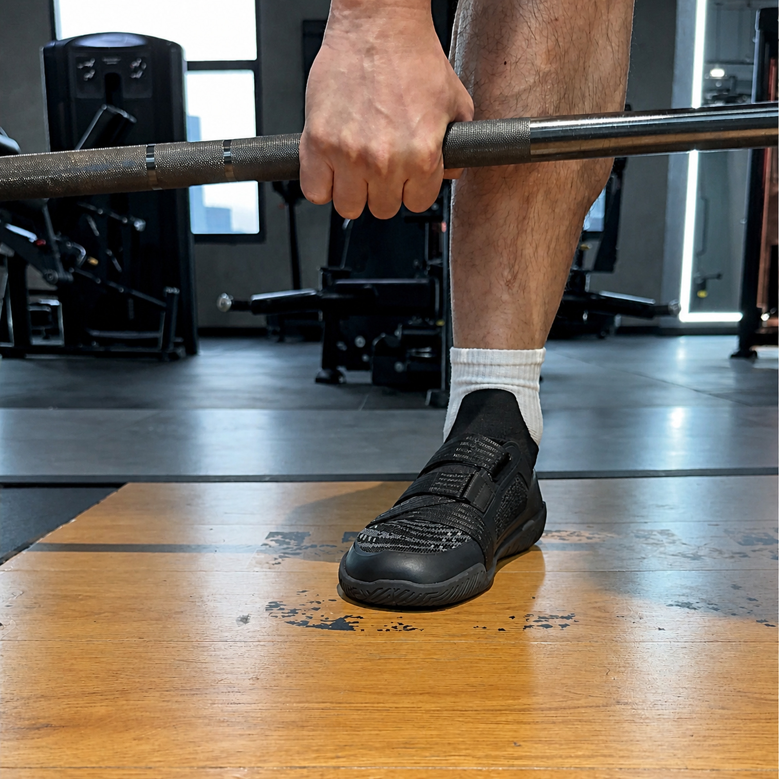 Style A shoe pressing into the lifting platform under a deadlift setup